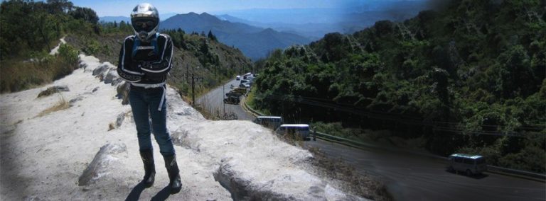 Doi Inthanon on a Scooter 4 a lady with motorcycle gear and a view