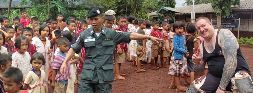 a group of children with men